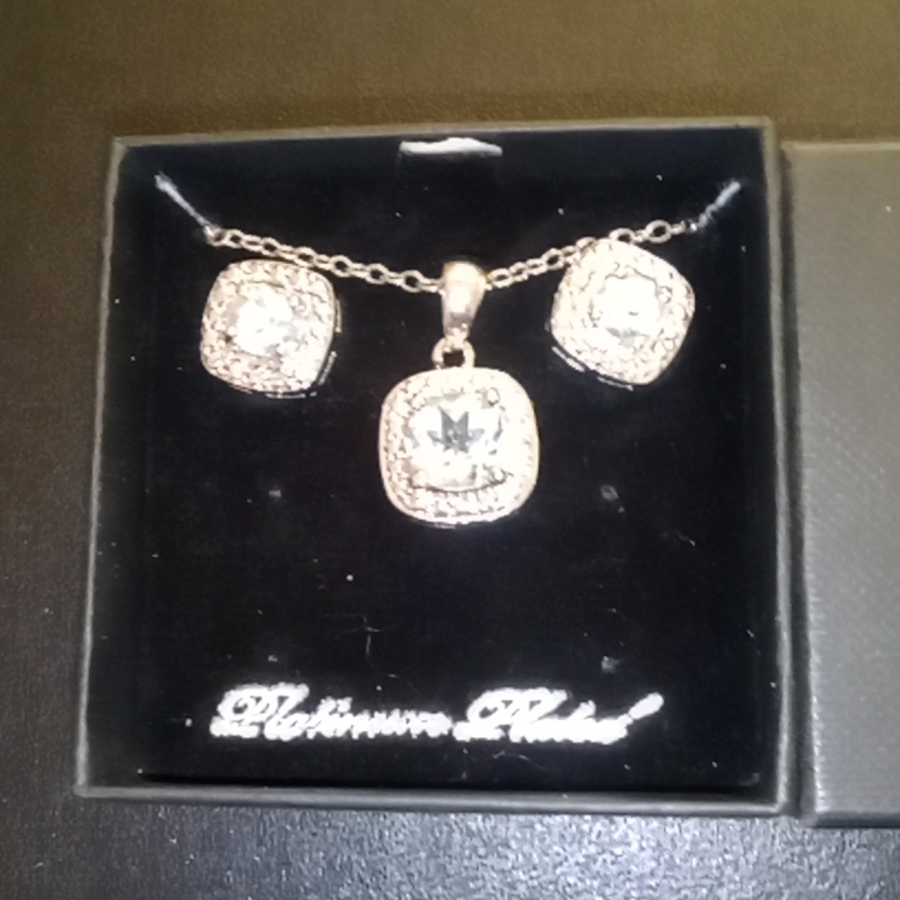 Platinum plated necklace with matching earrings.